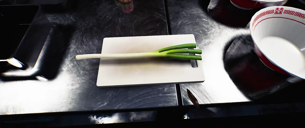 Japanese Ramen Simulator a single uncut green scallion lying on a white plastic cutting board on a dark counter, knife tip visible at the edge and an empty red-and-white ramen bowl at the top right